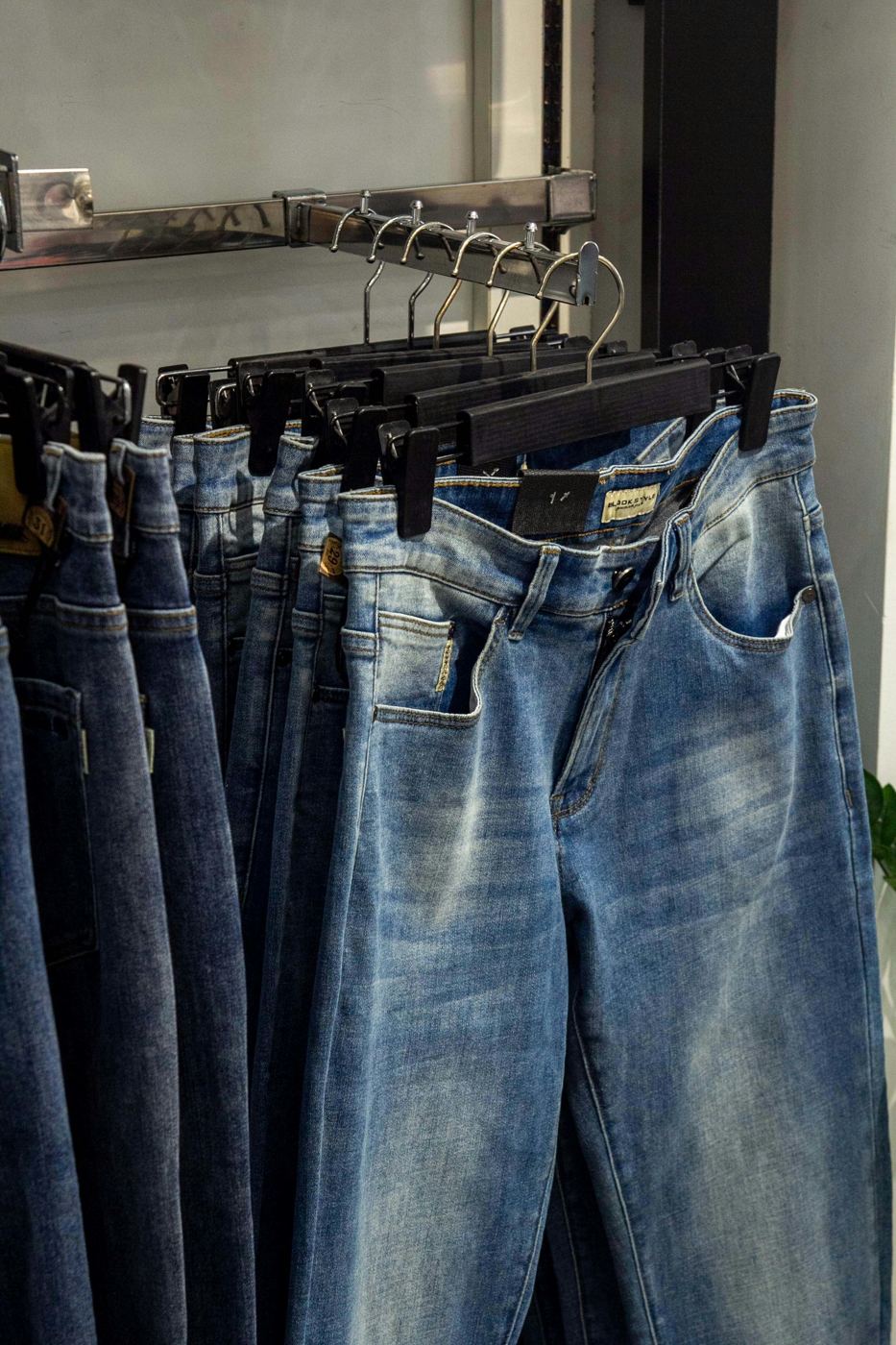Rack of washed denim jeans