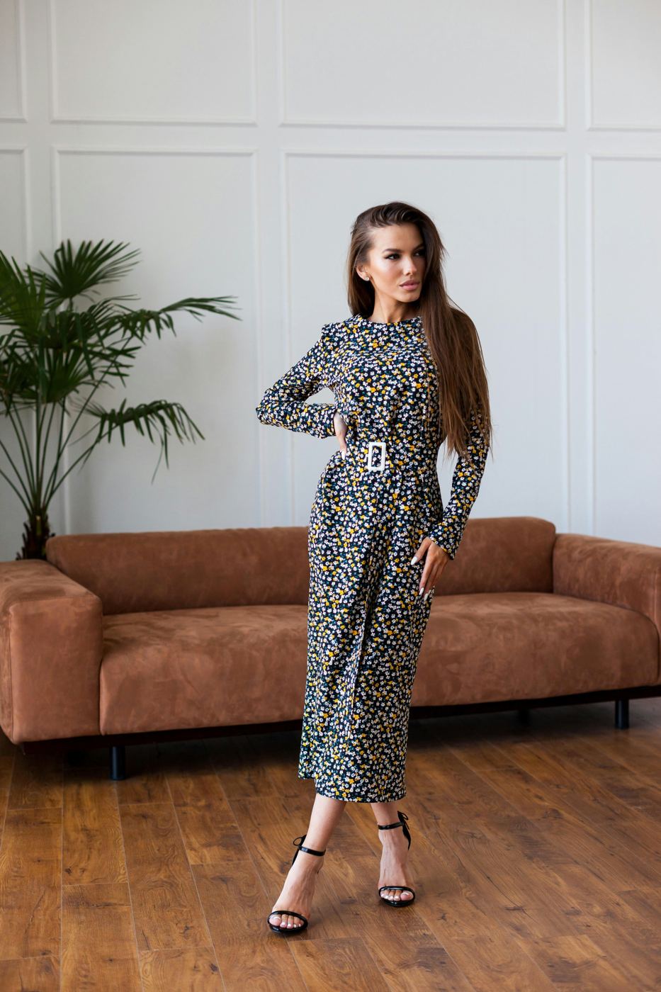 Model in a belted floral midi dress